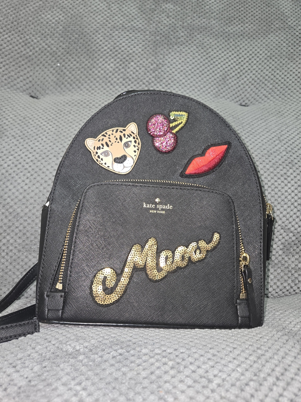 kate spade black backpack with gold sequin 'Meow' script and playful patches